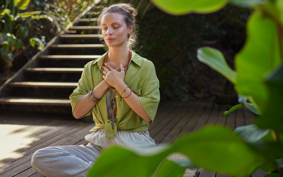 Woman meditating to alleviate her disconnection stress.