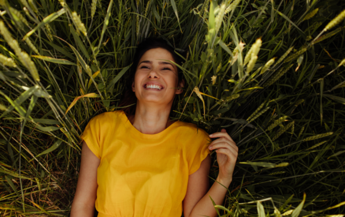 Woman embodying authentic happiness and inner peace through building Stress Intelligence.