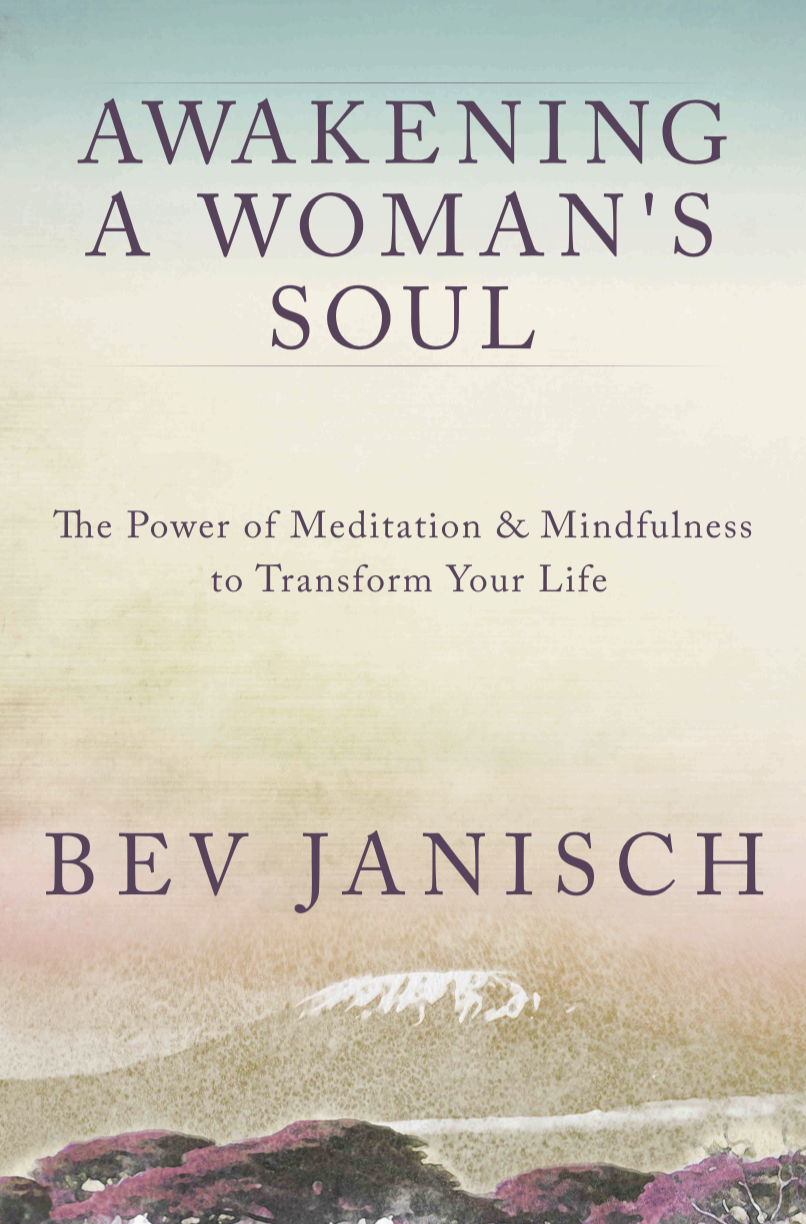 Bev Janisch holding her book, Awakening a Woman's Soul